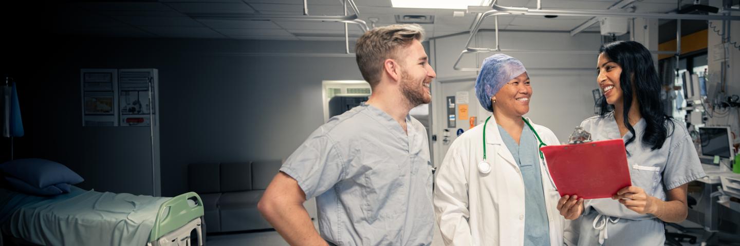 Doctor and nurses discussing a report